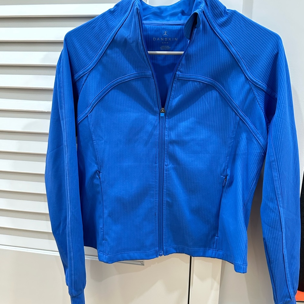 Deep Blue Brand New Danskin Ribbed Zipper in S (2-6). Has Zips, Thump space.